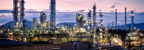 Manufacturing of petroleum industrial plant on sky twilight background, Oil and gas refinery or Petrochemical industry plant with distillation tower
