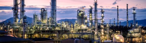 Manufacturing of petroleum industrial plant on sky twilight background, Oil and gas refinery or Petrochemical industry plant with distillation tower