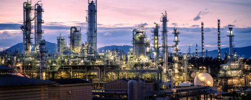 Manufacturing of petroleum industrial plant on sky twilight background, Oil and gas refinery or Petrochemical industry plant with distillation tower